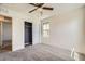 Bright bedroom features a ceiling fan, window, and closet with sliding doors at 2862 Starling Summit St, Henderson, NV 89044