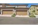 Townhome exterior with individual garages, and desert landscaping at 2862 Starling Summit St, Henderson, NV 89044