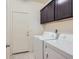 Functional laundry area with cabinets and appliances for convenient chores at 2862 Starling Summit St, Henderson, NV 89044