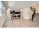 Stylish open-concept living space connecting kitchen and stairs with modern design at 2862 Starling Summit St, Henderson, NV 89044