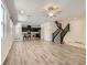 Open-concept living room with hardwood floors and staircase, perfect for entertaining at 2862 Starling Summit St, Henderson, NV 89044