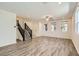 Bright and airy living room with wood floors, staircase and plenty of natural light at 2862 Starling Summit St, Henderson, NV 89044