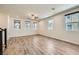 Spacious living area with wood floors and ample windows, offering a comfortable living space at 2862 Starling Summit St, Henderson, NV 89044