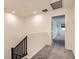 Upstairs hallway with carpeted floors and a view into another room at 2862 Starling Summit St, Henderson, NV 89044
