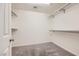 Walk-in closet offers ample shelving and carpet flooring at 2862 Starling Summit St, Henderson, NV 89044