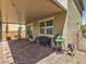 Backyard patio boasting a covered area with string lights, BBQ grill, and cozy seating, ideal for outdoor gatherings at 2936 Aragon Terrace Way, Henderson, NV 89044
