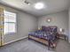 This neutral bedroom features carpet and a window for natural light at 2936 Aragon Terrace Way, Henderson, NV 89044