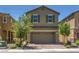 Charming two-story home with desert landscaping and a brick-paved driveway leading to a spacious two car garage at 2936 Aragon Terrace Way, Henderson, NV 89044