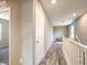 Hallway showcases stylish wood flooring and natural lighting, leading to bedrooms and stairs at 2936 Aragon Terrace Way, Henderson, NV 89044