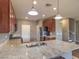 Stylish kitchen with granite countertops, dark wood cabinets, and stainless steel appliances at 2936 Aragon Terrace Way, Henderson, NV 89044