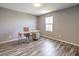Office space with wood floors, desk, modern chair, and natural light from a large window at 2936 Aragon Terrace Way, Henderson, NV 89044