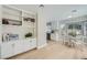 View of the breakfast nook with white cabinets, table and view to the kitchen at 3012 Haddon Dr, Las Vegas, NV 89134
