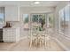 Bright breakfast nook with white table, chairs and bay window with natural light at 3012 Haddon Dr, Las Vegas, NV 89134