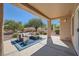 Inviting covered patio with comfortable seating, landscaping and views of the surrounding area at 3012 Haddon Dr, Las Vegas, NV 89134