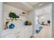 Bright entryway with built-in cabinets, shelving and seamless access to dining room at 3012 Haddon Dr, Las Vegas, NV 89134