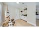 Inviting entryway with built-in storage, art easel, and wood-look flooring at 3012 Haddon Dr, Las Vegas, NV 89134
