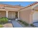Inviting front entrance featuring decorative pillars, a security screen door, and tastefully landscaped surroundings at 3012 Haddon Dr, Las Vegas, NV 89134