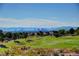 Scenic view of a lush green golf course with city skyline in the distance, ideal for golf enthusiasts at 3012 Haddon Dr, Las Vegas, NV 89134