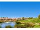 Scenic golf course view with lush green grass, water feature, and luxury homes at 3012 Haddon Dr, Las Vegas, NV 89134