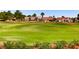 Beautiful golf course community surrounded by houses and palm trees at 3012 Haddon Dr, Las Vegas, NV 89134