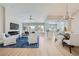 Bright and spacious living room with hardwood floors, contemporary furnishings, and modern fireplace feature at 3012 Haddon Dr, Las Vegas, NV 89134