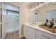 Bright main bathroom with marble counter tops, vanity and walk-in shower at 3012 Haddon Dr, Las Vegas, NV 89134