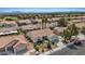 A beautiful community with desert landscaping and tile roofs, with mountain views in the distance at 3024 Lotus Hill Dr, Las Vegas, NV 89134