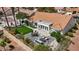 Backyard featuring a well-manicured lawn, mature landscaping, and a covered patio with furnishings at 3024 Lotus Hill Dr, Las Vegas, NV 89134