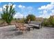 Relaxing backyard patio area with comfortable seating, perfect for enjoying outdoor gatherings and sunny days at 3024 Lotus Hill Dr, Las Vegas, NV 89134