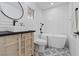 Modern bathroom with a freestanding tub, sleek vanity, and stylish tile flooring at 3024 Lotus Hill Dr, Las Vegas, NV 89134