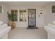 Charming front porch with decorative planters and secure entrance, creating an inviting and secure welcome at 3024 Lotus Hill Dr, Las Vegas, NV 89134