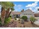 Charming single-story home with mature landscaping, rock garden, and a two-car garage at 3024 Lotus Hill Dr, Las Vegas, NV 89134