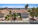 Charming single-story home with desert landscaping, a two-car garage and a mountain view at 3024 Lotus Hill Dr, Las Vegas, NV 89134