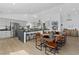 Modern kitchen with stainless steel appliances, a large island, and an adjacent dining area at 3024 Lotus Hill Dr, Las Vegas, NV 89134