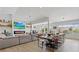 Bright open-concept living and dining area featuring modern fireplace, hardwood floors, and plenty of natural light at 3024 Lotus Hill Dr, Las Vegas, NV 89134