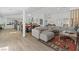 Open-concept living space with a modern kitchen, dining area, and comfortable sectional at 3024 Lotus Hill Dr, Las Vegas, NV 89134