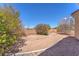 The backyard is spacious with gravel and dirt landscaping at 3056 Monroe Park Rd, Henderson, NV 89052