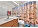 Bathroom featuring vanity, toilet, and bath with a playful beach-themed shower curtain at 3056 Monroe Park Rd, Henderson, NV 89052