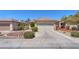 A single-story home with a two-car garage and desert landscaping at 3056 Monroe Park Rd, Henderson, NV 89052