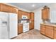 Functional kitchen with stainless steel appliances, wood cabinetry, and stone countertops at 3056 Monroe Park Rd, Henderson, NV 89052