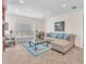 Comfortable living room featuring tile floors, neutral paint, and plantation shutters at 3056 Monroe Park Rd, Henderson, NV 89052