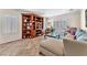 Cozy living room features custom built-in shelving, tile flooring, and plantation shutters at 3056 Monroe Park Rd, Henderson, NV 89052