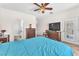 Relaxing main bedroom with ceiling fan, ensuite bathroom, and sliding door to outdoor patio at 3056 Monroe Park Rd, Henderson, NV 89052
