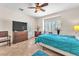 Bright main bedroom with large windows, shutters, and a ceiling fan at 3056 Monroe Park Rd, Henderson, NV 89052