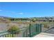 Picturesque backyard view featuring desert landscape, neighborhood scenery, and open walking paths at 3079 Evening Mist Ave, Henderson, NV 89052