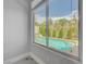 View of the backyard pool and neighboring homes from inside this bright and open home at 3079 Evening Mist Ave, Henderson, NV 89052