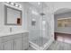 Bathroom featuring sleek vanity with modern fixtures and glass enclosed walk-in shower at 3079 Evening Mist Ave, Henderson, NV 89052