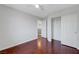 Bedroom featuring hardwood floors, closet with doors, and bright neutral paint at 3079 Evening Mist Ave, Henderson, NV 89052