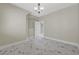 Bedroom with an open doorway and neutral walls at 3079 Evening Mist Ave, Henderson, NV 89052
