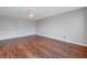 Light filled bedroom featuring hardwood floors, neutral paint and ample space for furniture at 3079 Evening Mist Ave, Henderson, NV 89052